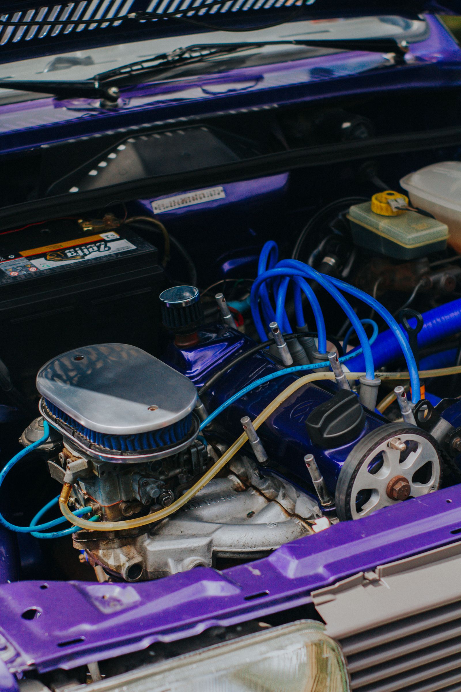 Close view of automotive engine components and fuel-system parts